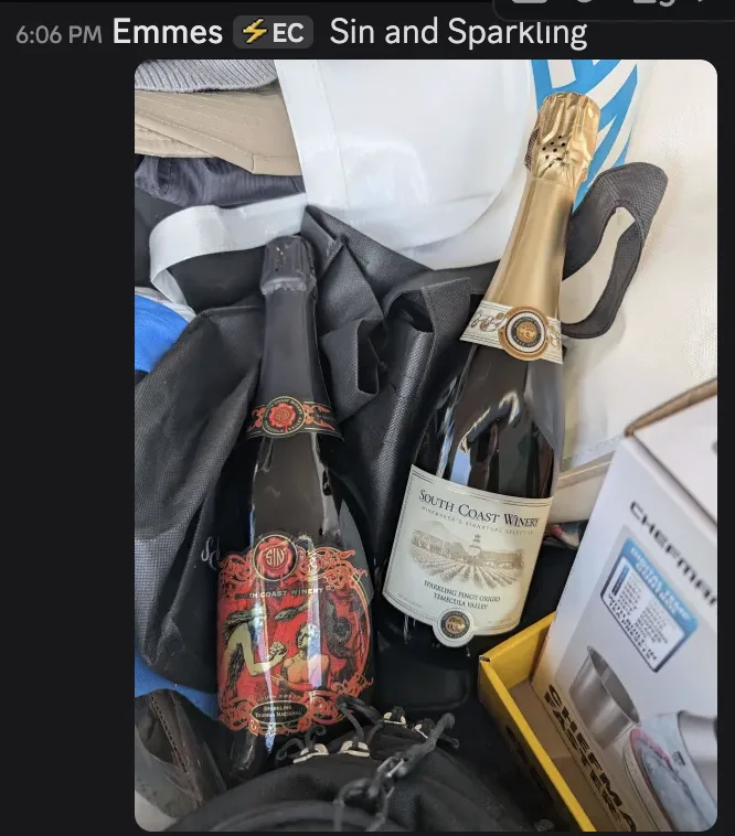 Discord message from Emmes at 6:06 PM reading "Sin and Sparkling", with a photo of two bottles of sparkling wine from South Coast Winery — one labelled Sin, one a Sparkling Pinot Grigio